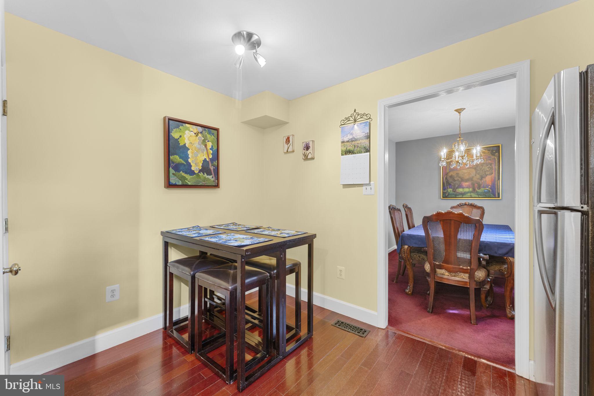 9801 Pulham Road Burke, VA 22015 - Photo 15 of 63 a view of a workspace with furniture and wooden floor