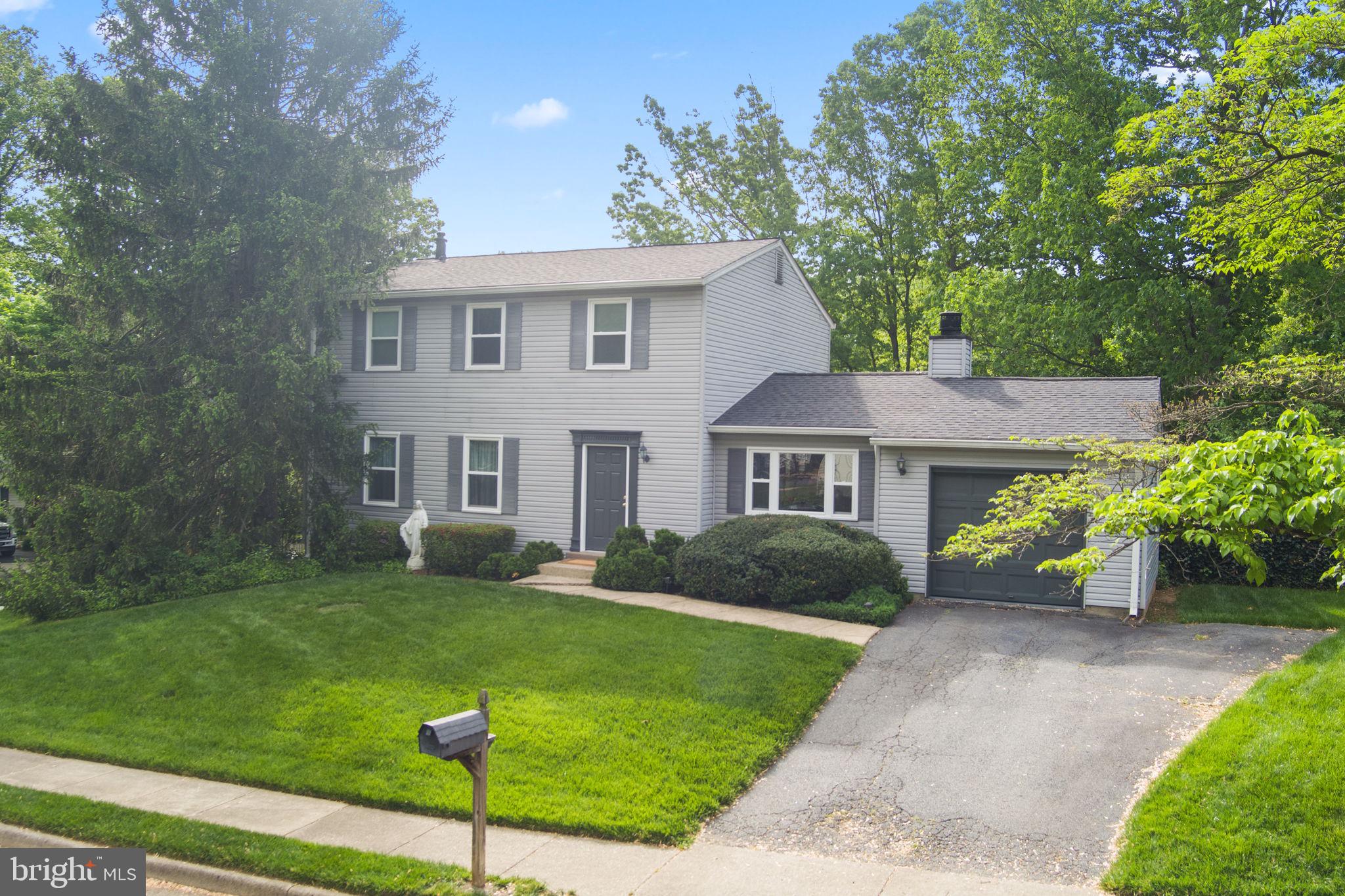 9801 Pulham Road Burke, VA 22015 - Photo 2 of 63 a view of a house with a garden