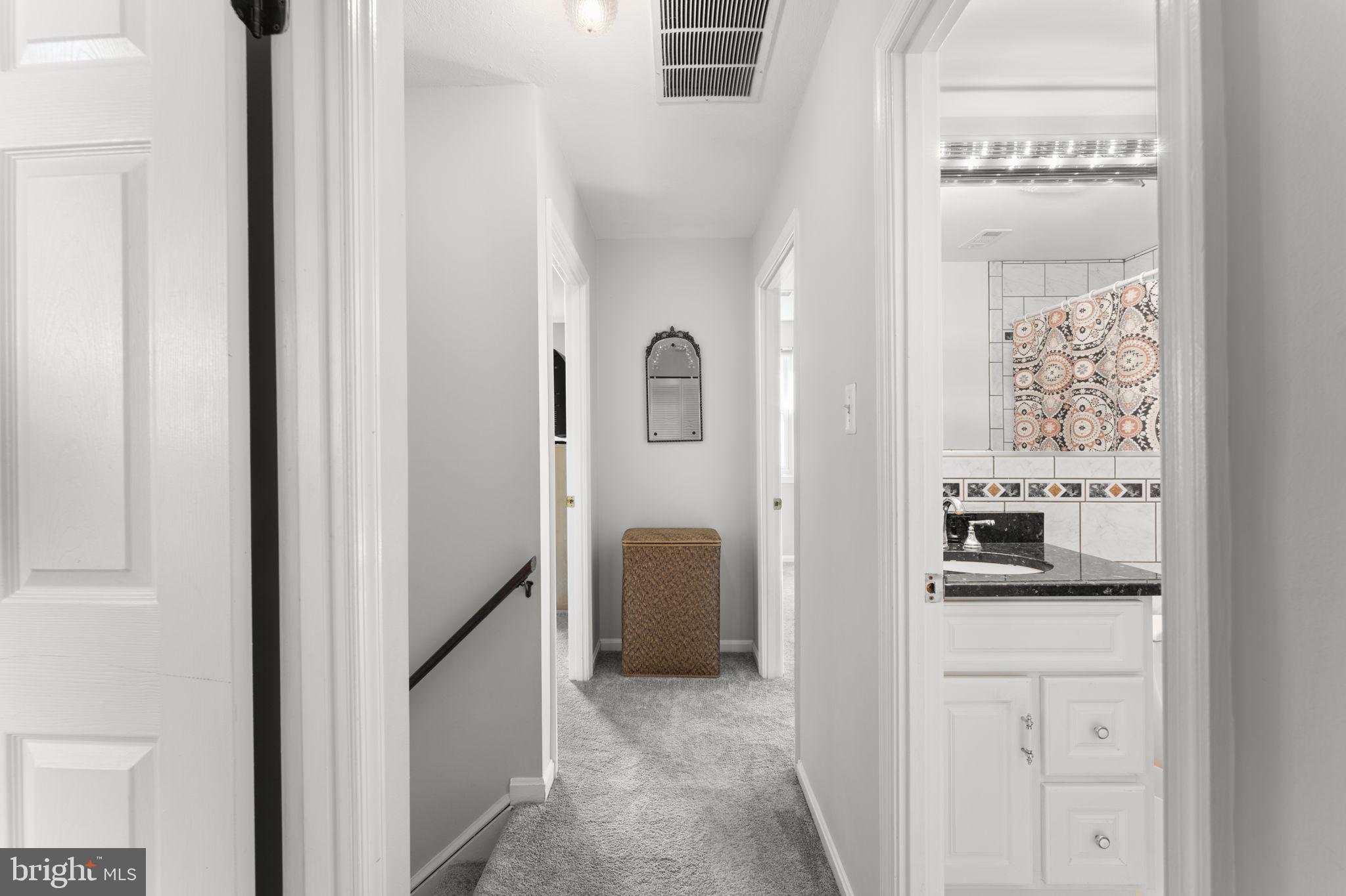9801 Pulham Road Burke, VA 22015 - Photo 23 of 63 a en suite bathroom with a sink and mirror