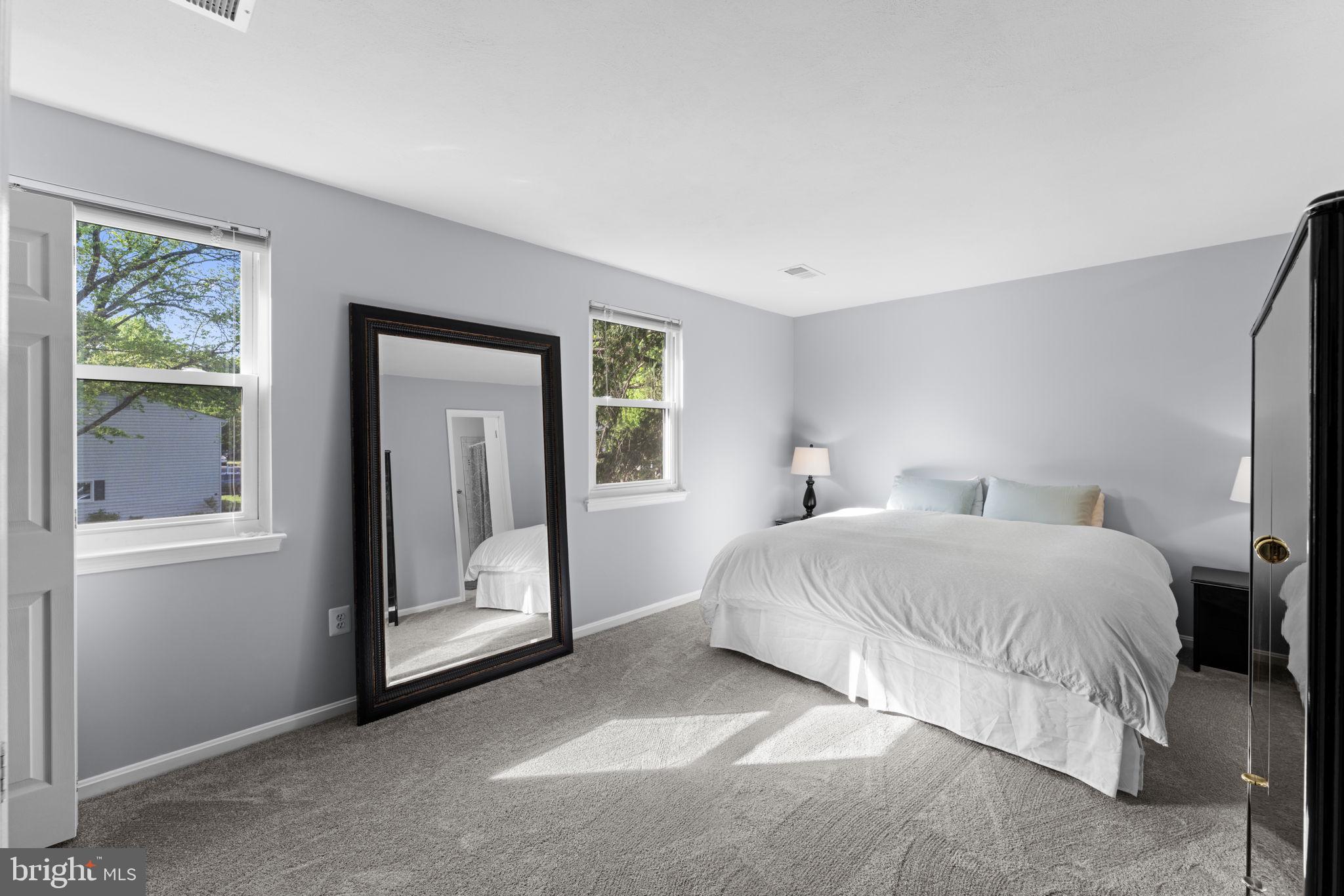 9801 Pulham Road Burke, VA 22015 - Photo 24 of 63 a bedroom with a bed and a painting