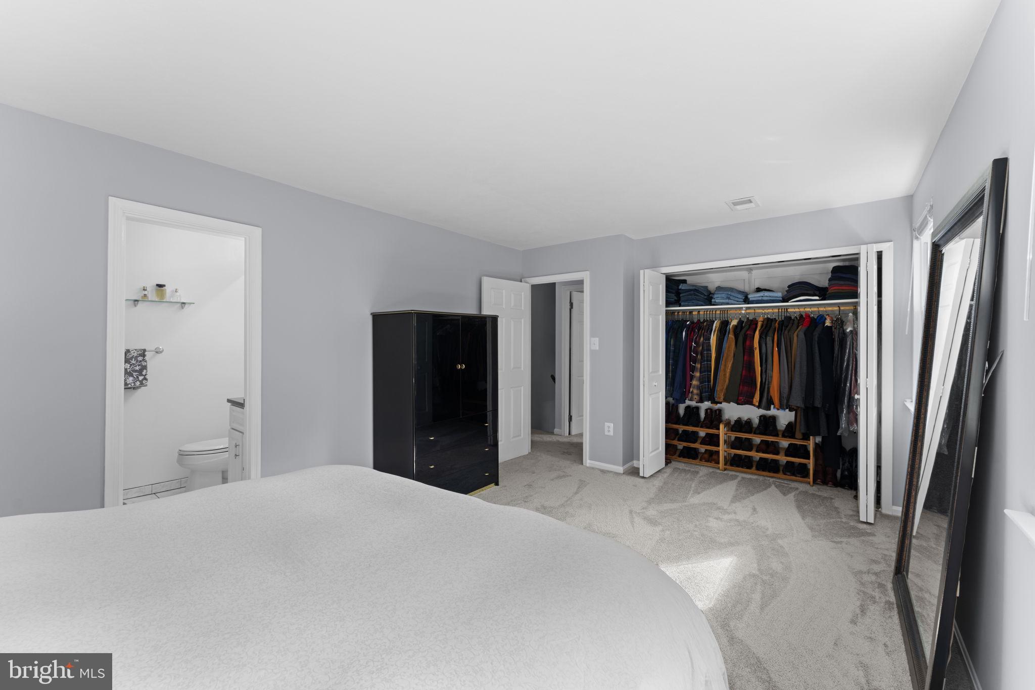 9801 Pulham Road Burke, VA 22015 - Photo 26 of 63 a bedroom with a bed and cabinets