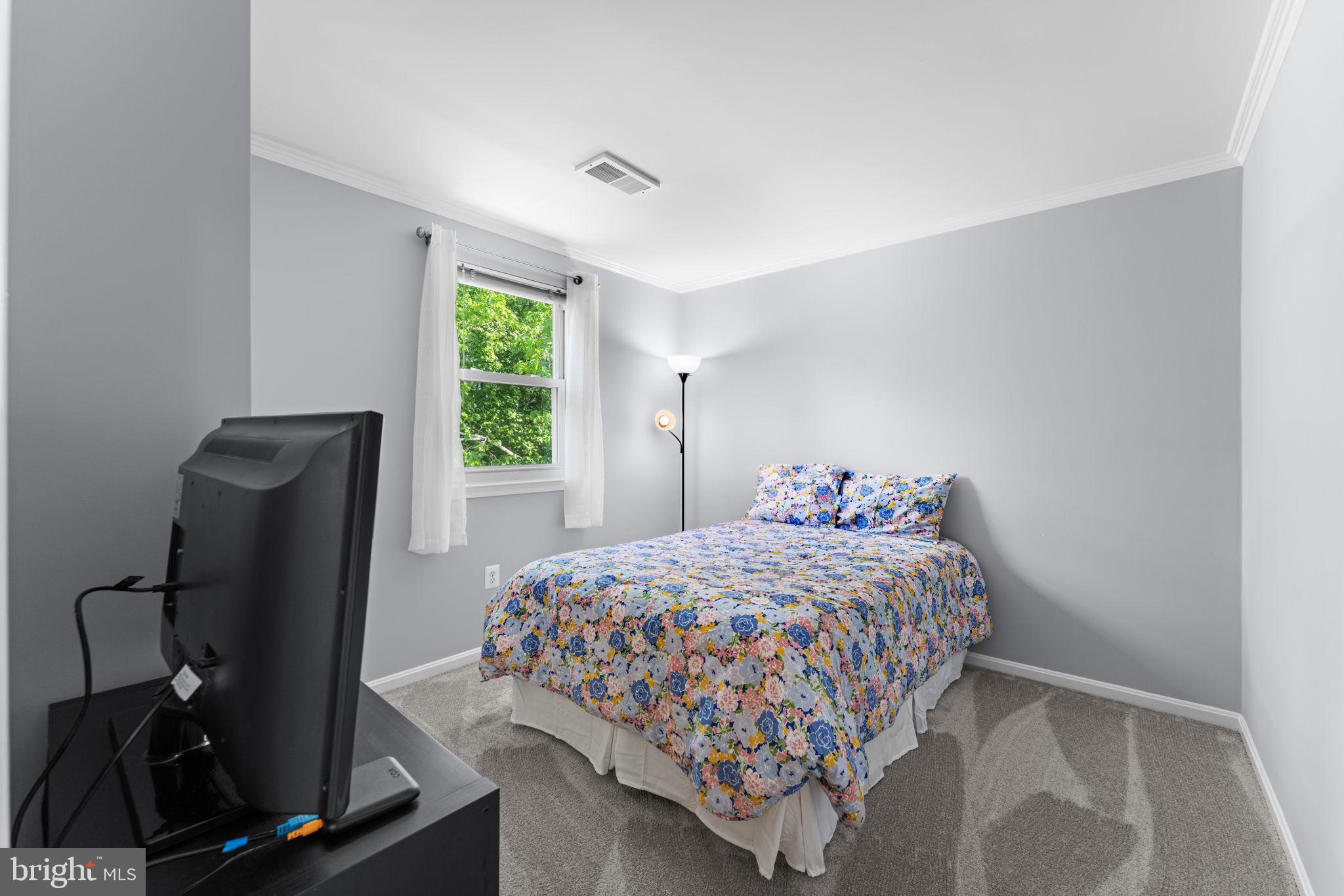 9801 Pulham Road Burke, VA 22015 - Photo 29 of 63 a bedroom with a bed and a window