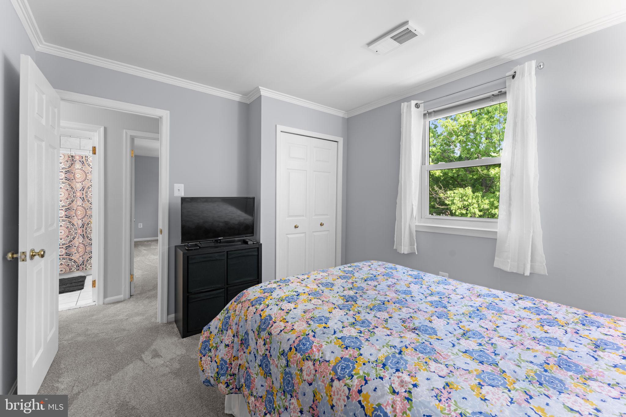 9801 Pulham Road Burke, VA 22015 - Photo 30 of 63 a bedroom with a bed and a window