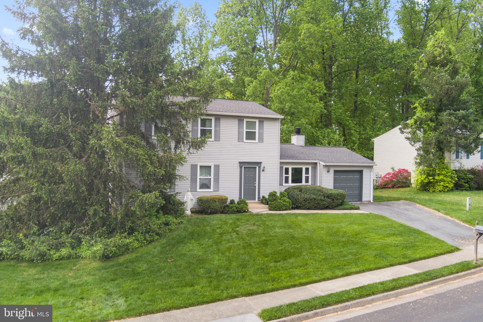 9801 Pulham Road Burke, VA 22015 - Photo 3 of 63 a front view of a house with a yard