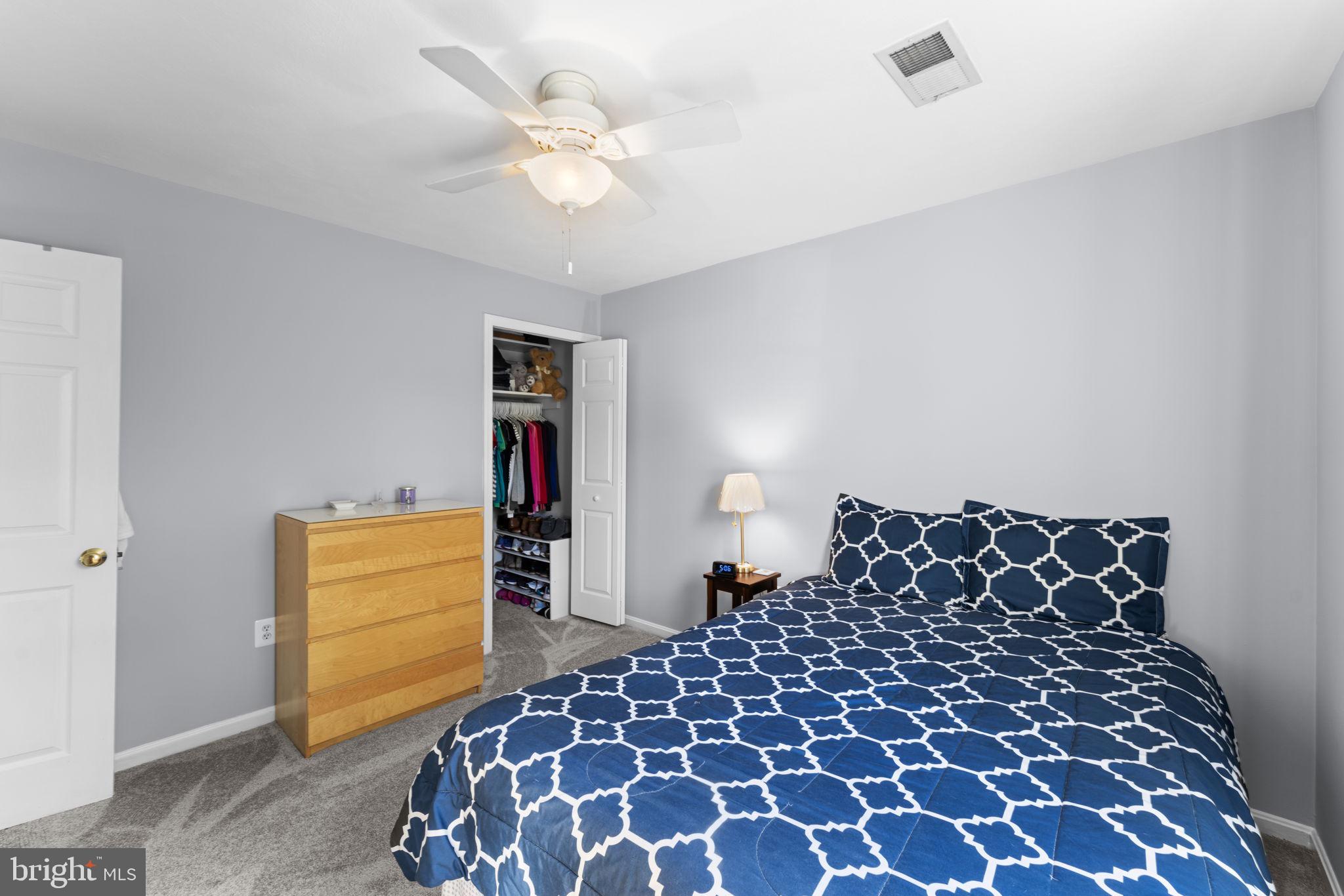 9801 Pulham Road Burke, VA 22015 - Photo 32 of 63 a bedroom with a bed and a cabinets
