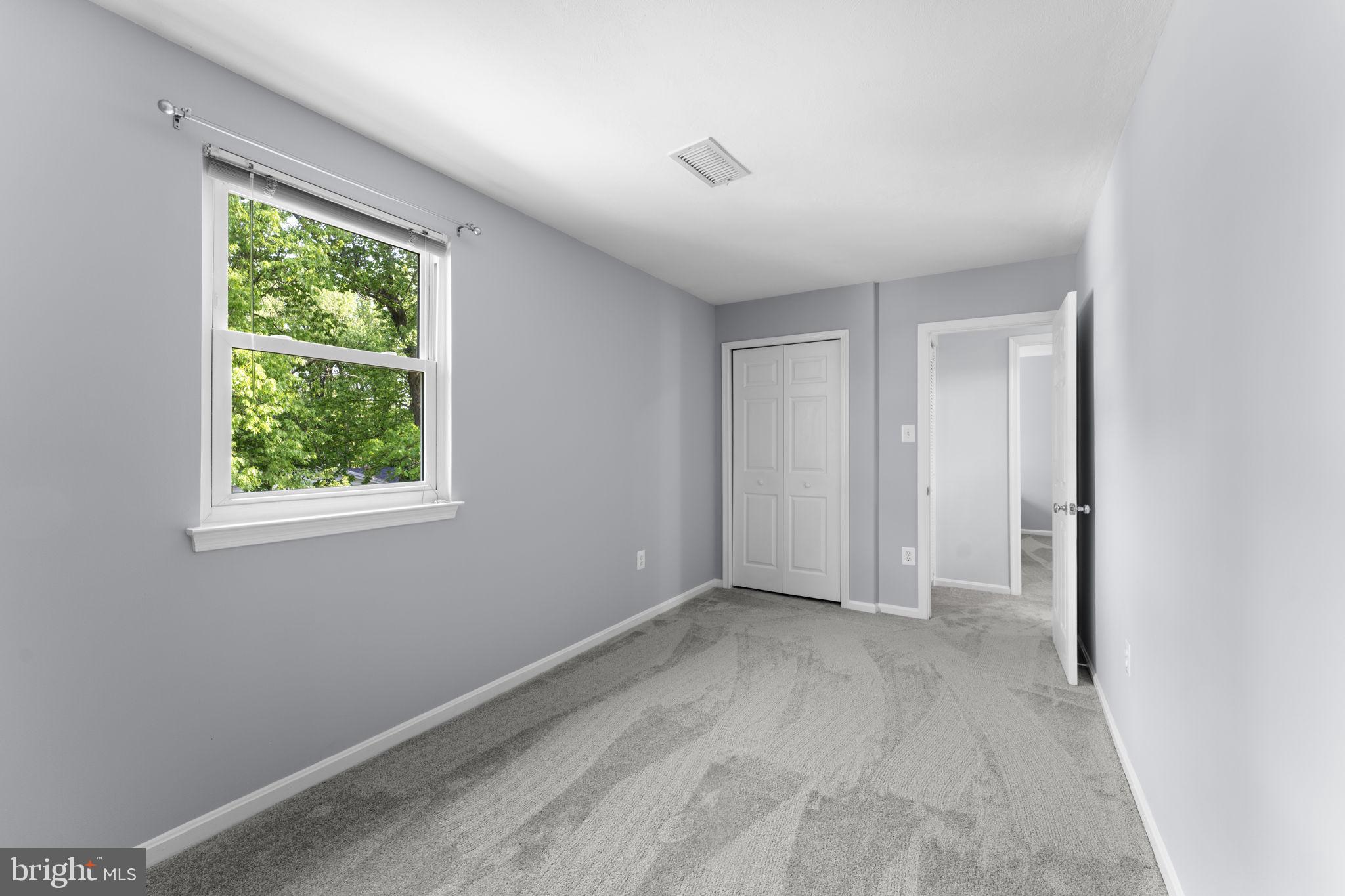 9801 Pulham Road Burke, VA 22015 - Photo 33 of 63 a view of an empty room with a window