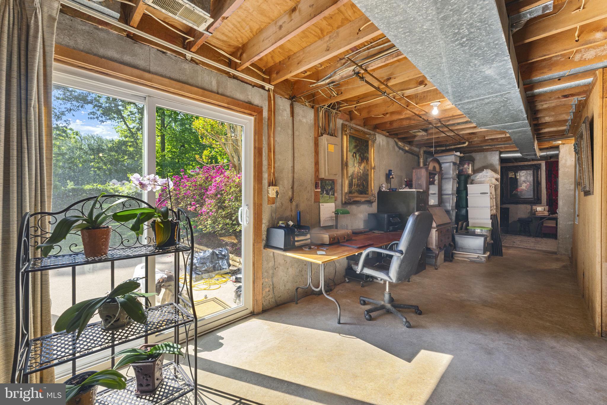 9801 Pulham Road Burke, VA 22015 - Photo 53 of 63 a view of a workspace with furniture and a window