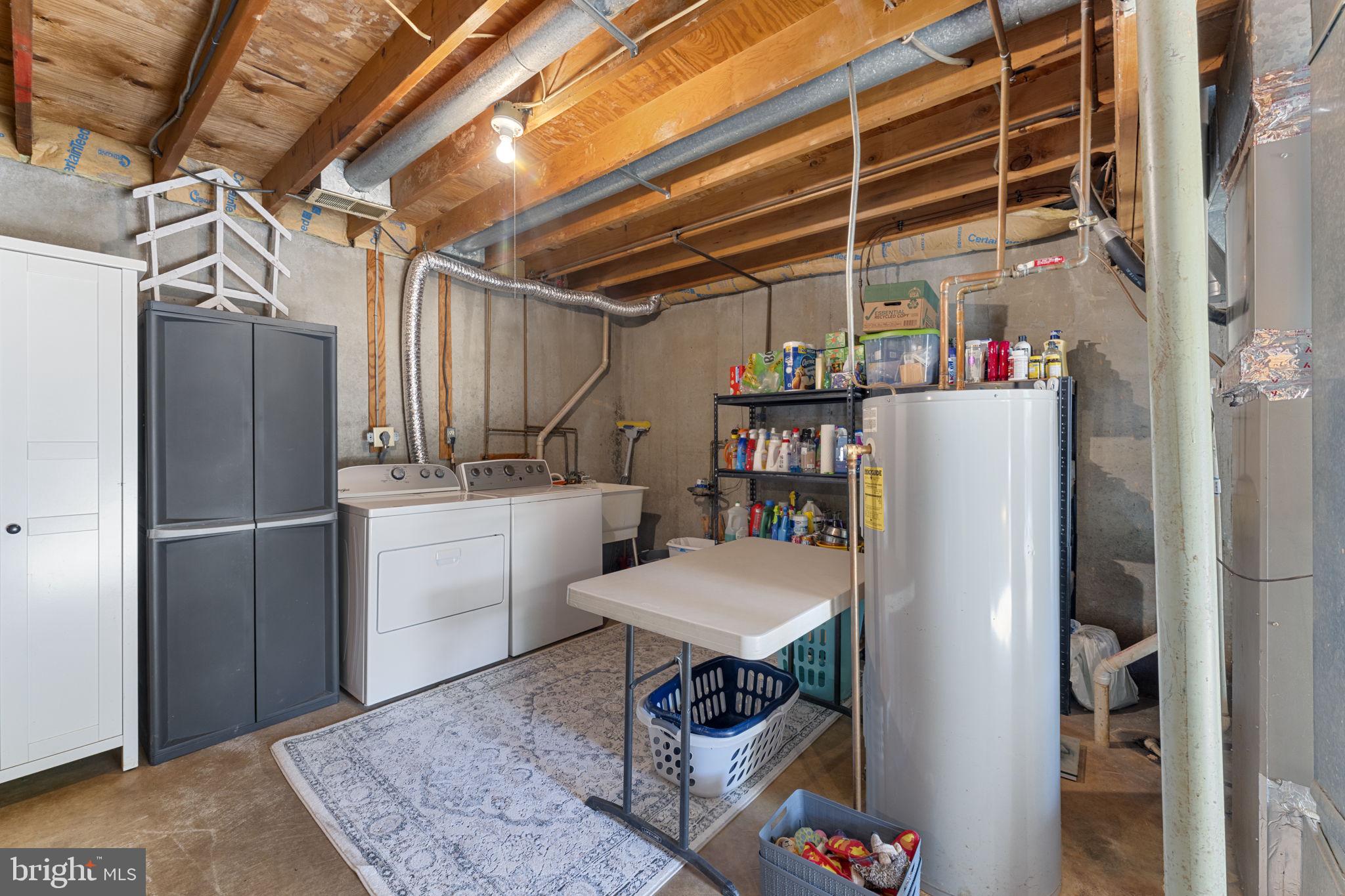 9801 Pulham Road Burke, VA 22015 - Photo 54 of 63 a utility room with dryer and washer