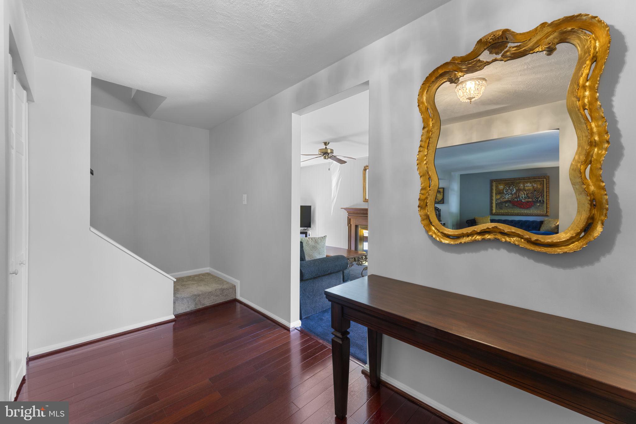 9801 Pulham Road Burke, VA 22015 - Photo 9 of 63 a room with a table and wooden floor