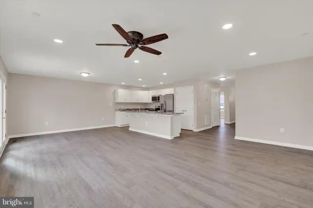 a view of kitchen with wooden floor and window