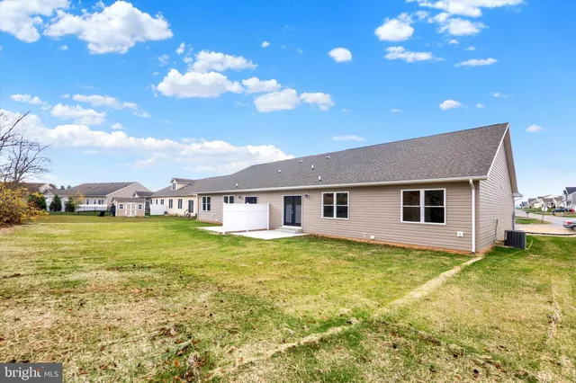 a view of yard with swimming pool and green space