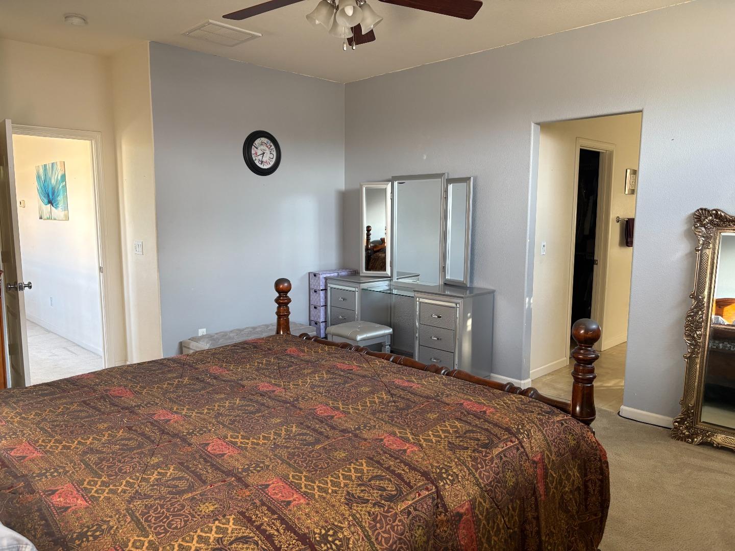 51 Sturla Way Gilroy, CA 95020 - Photo 14 of 27 a bedroom with a bed and a large mirror on the dresser