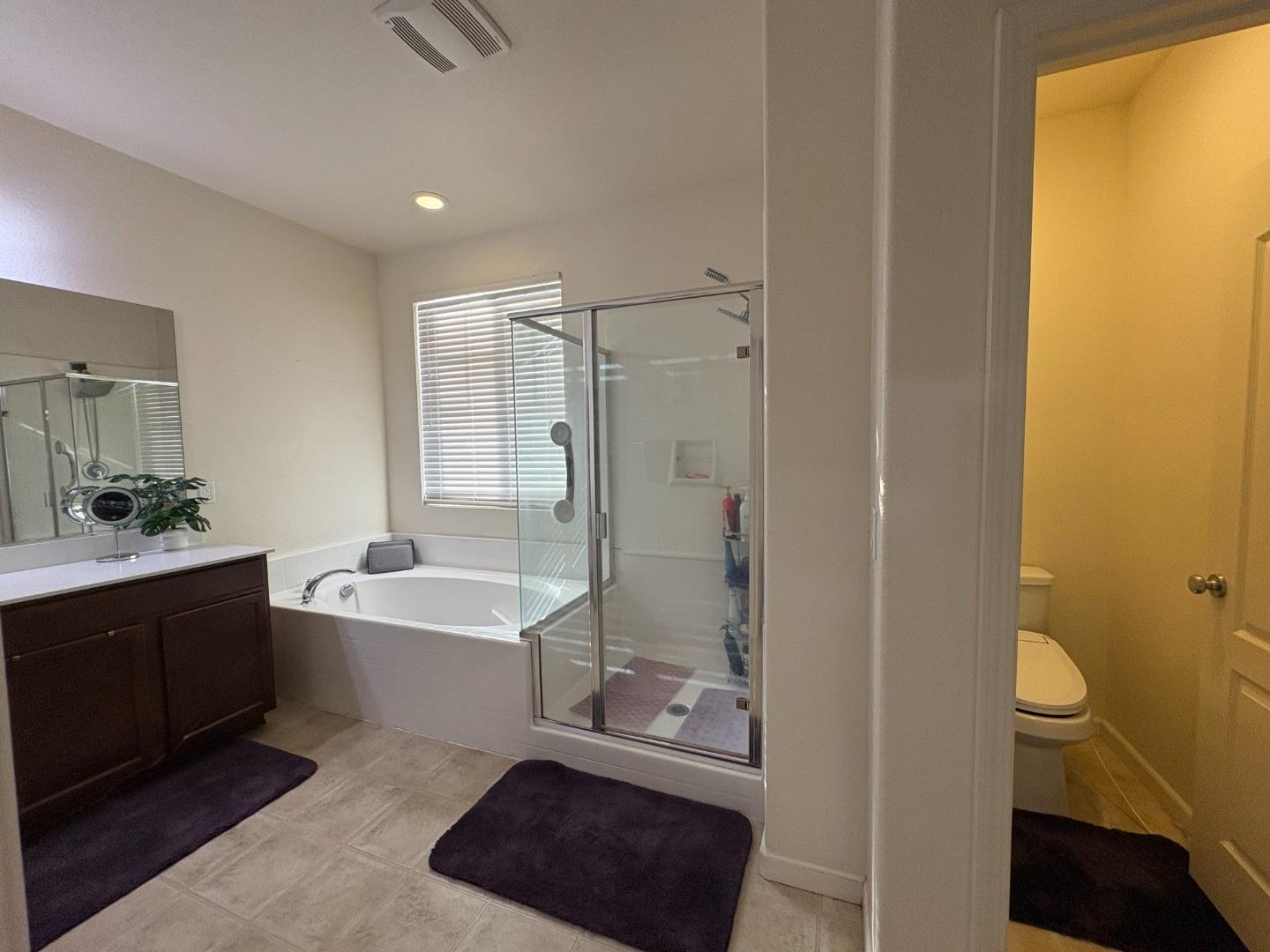 51 Sturla Way Gilroy, CA 95020 - Photo 15 of 27 a bathroom with a sink a toilet and shower