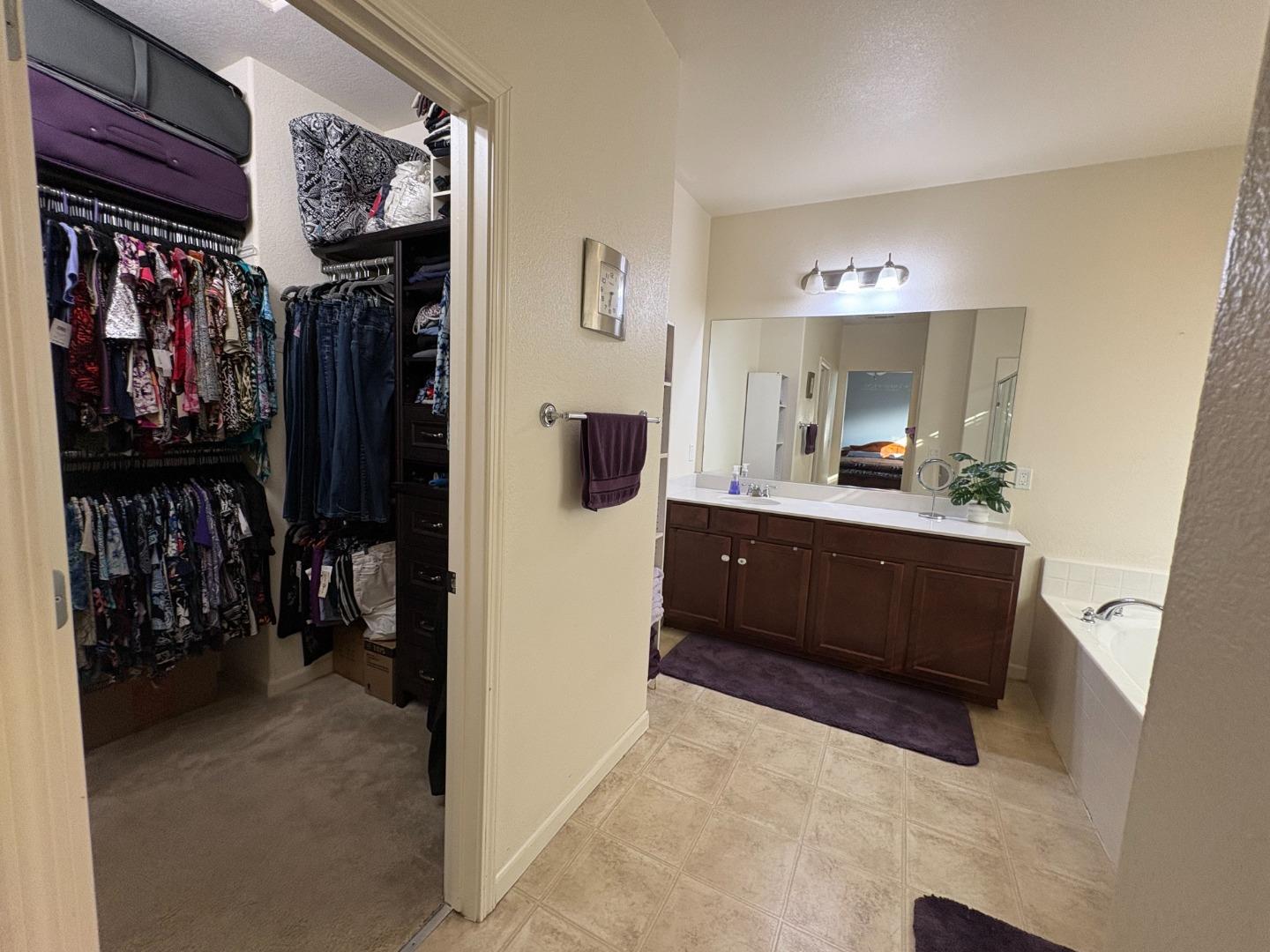 51 Sturla Way Gilroy, CA 95020 - Photo 16 of 27 a en suite bathroom with a sink and a mirror