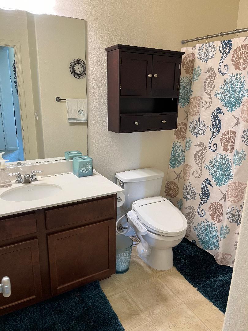 51 Sturla Way Gilroy, CA 95020 - Photo 19 of 27 a bathroom with a sink and a toilet
