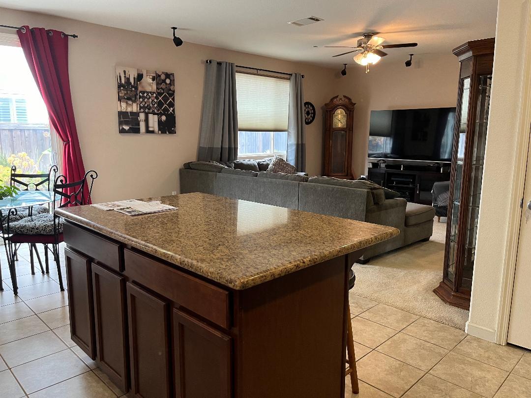 51 Sturla Way Gilroy, CA 95020 - Photo 4 of 27 a kitchen with a counter space and a sink