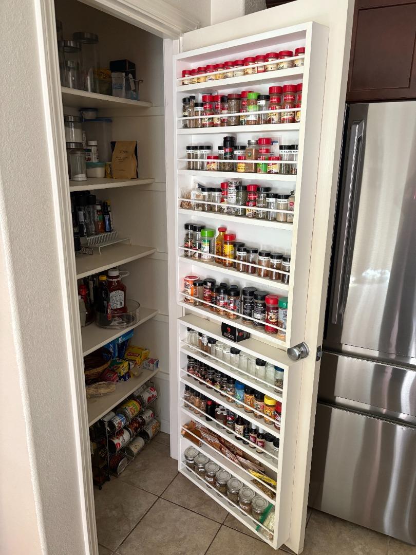 51 Sturla Way Gilroy, CA 95020 - Photo 6 of 27 a view of walk in closet with clothes and shoes