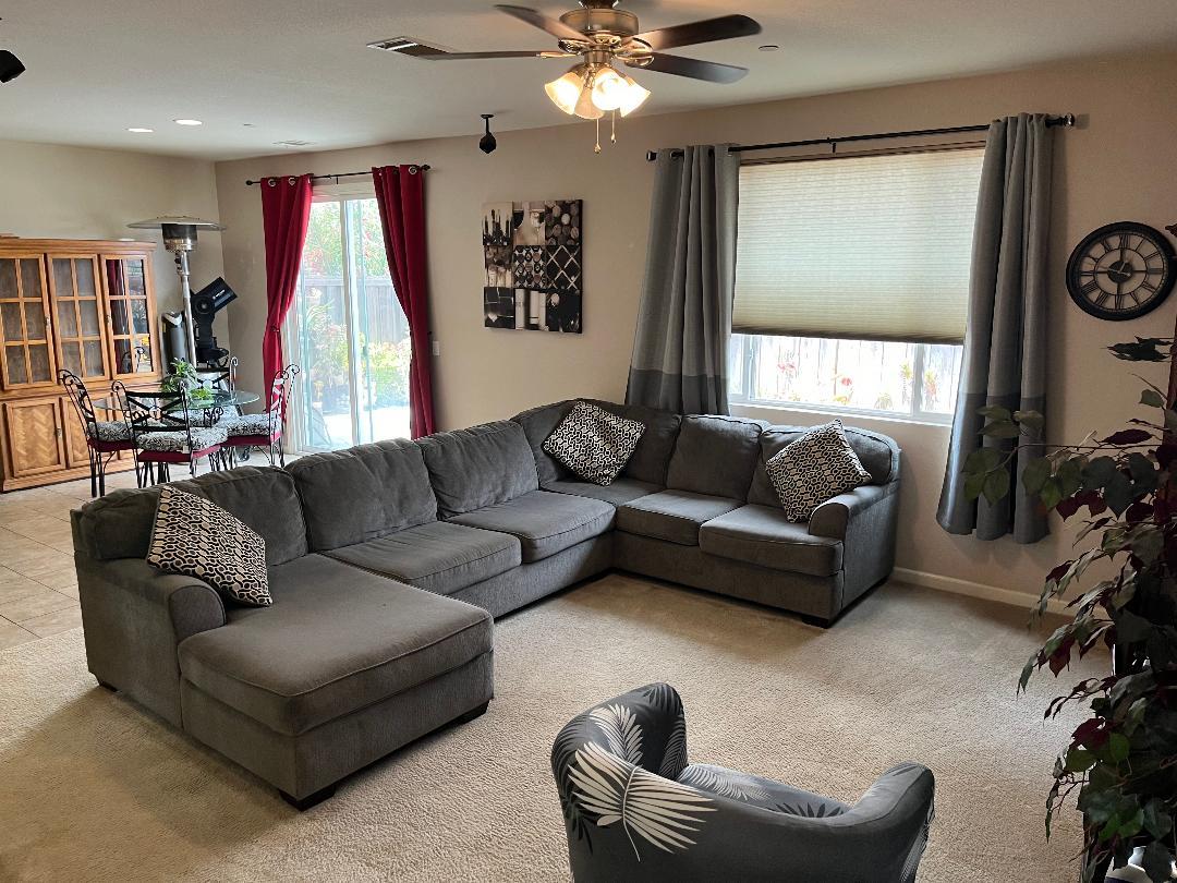 51 Sturla Way Gilroy, CA 95020 - Photo 7 of 27 a living room with furniture and a large window