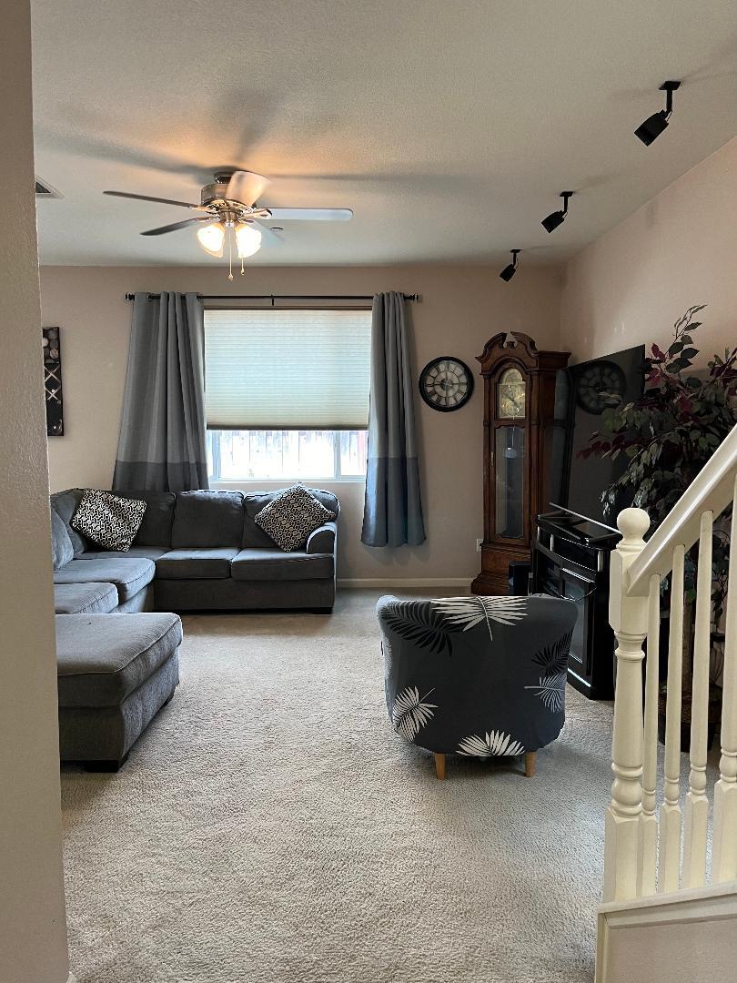 51 Sturla Way Gilroy, CA 95020 - Photo 9 of 27 a living room with furniture and a flat screen tv