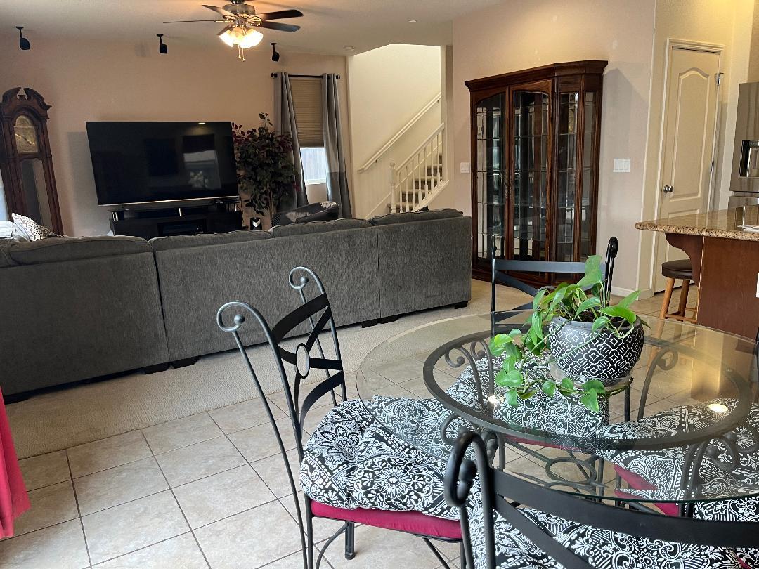 51 Sturla Way Gilroy, CA 95020 - Photo 10 of 27 a living room with furniture and a flat screen tv