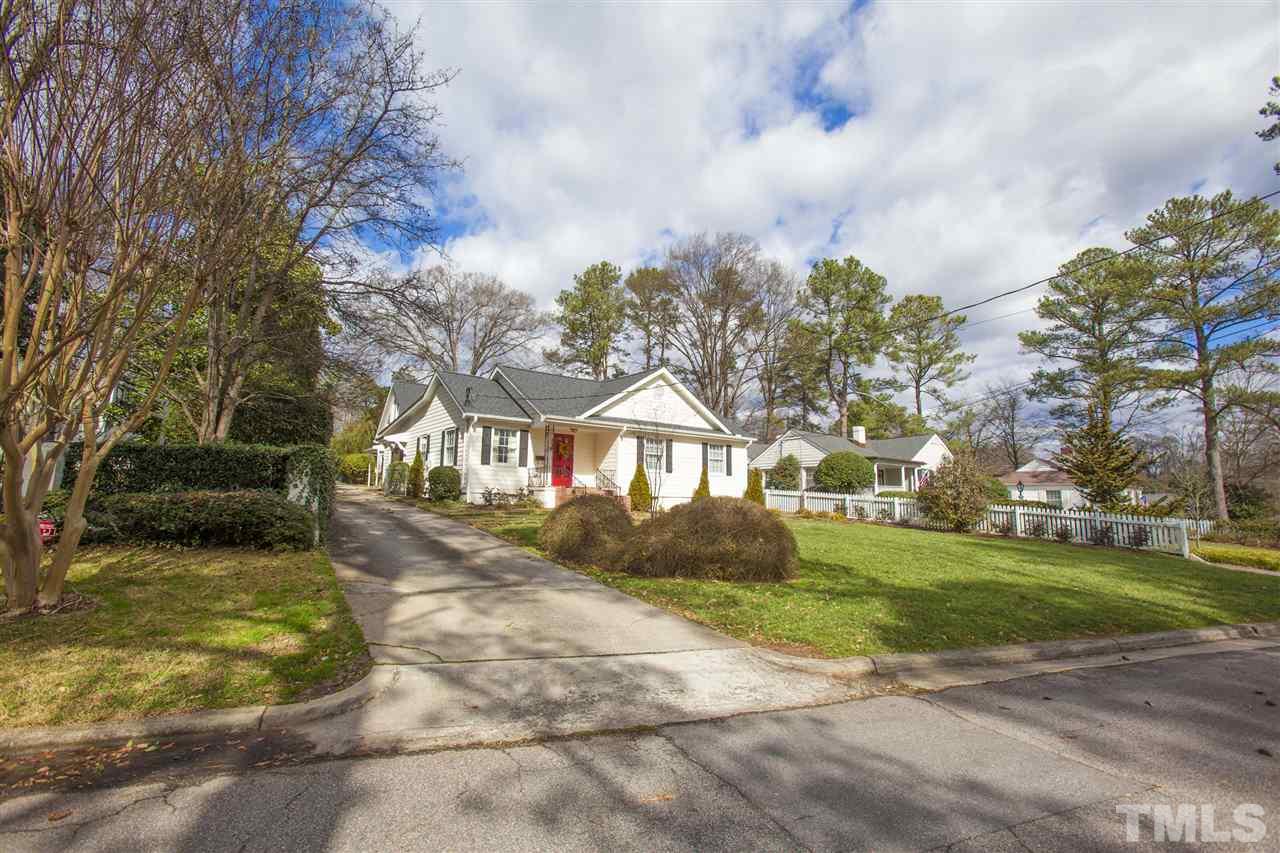 2609 Kittrell Drive Raleigh, NC 27608 - Photo 2 of 25 a view of a big house with a big yard and large trees