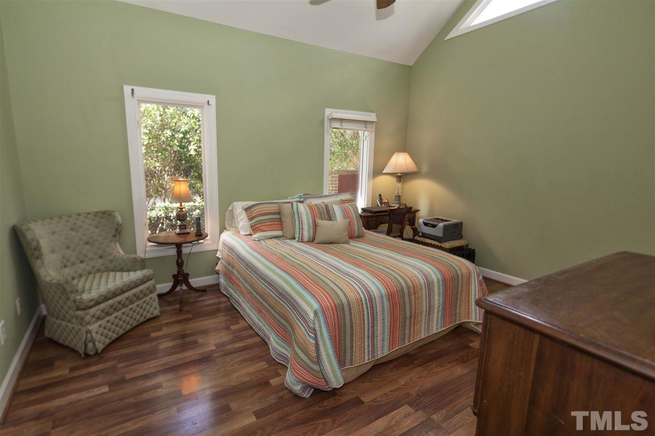 2609 Kittrell Drive Raleigh, NC 27608 - Photo 12 of 25 a bedroom with a bed and a couch