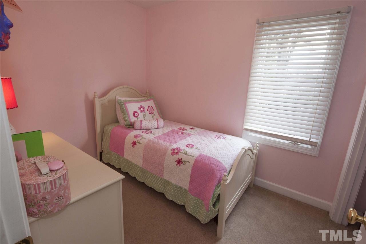 2609 Kittrell Drive Raleigh, NC 27608 - Photo 14 of 25 a bedroom with a bed and window