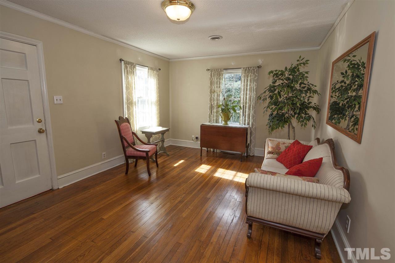 2609 Kittrell Drive Raleigh, NC 27608 - Photo 16 of 25 a living room with furniture and a window