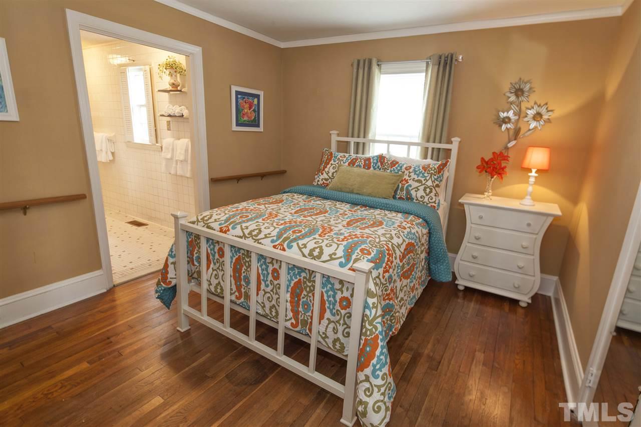 2609 Kittrell Drive Raleigh, NC 27608 - Photo 22 of 25 a bedroom with a bed and a window