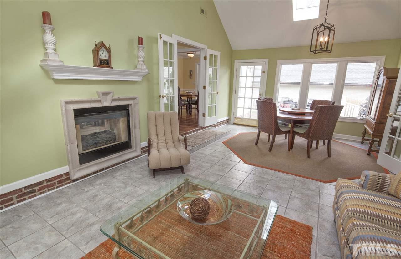 2609 Kittrell Drive Raleigh, NC 27608 - Photo 5 of 25 a living room with furniture and a fireplace