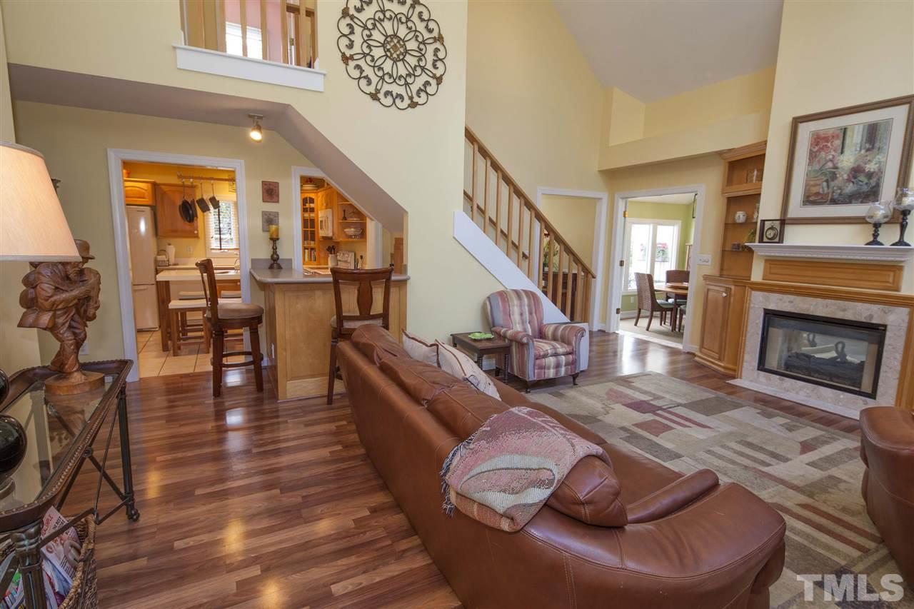 2609 Kittrell Drive Raleigh, NC 27608 - Photo 6 of 25 a living room with furniture or fireplace and a wooden floor