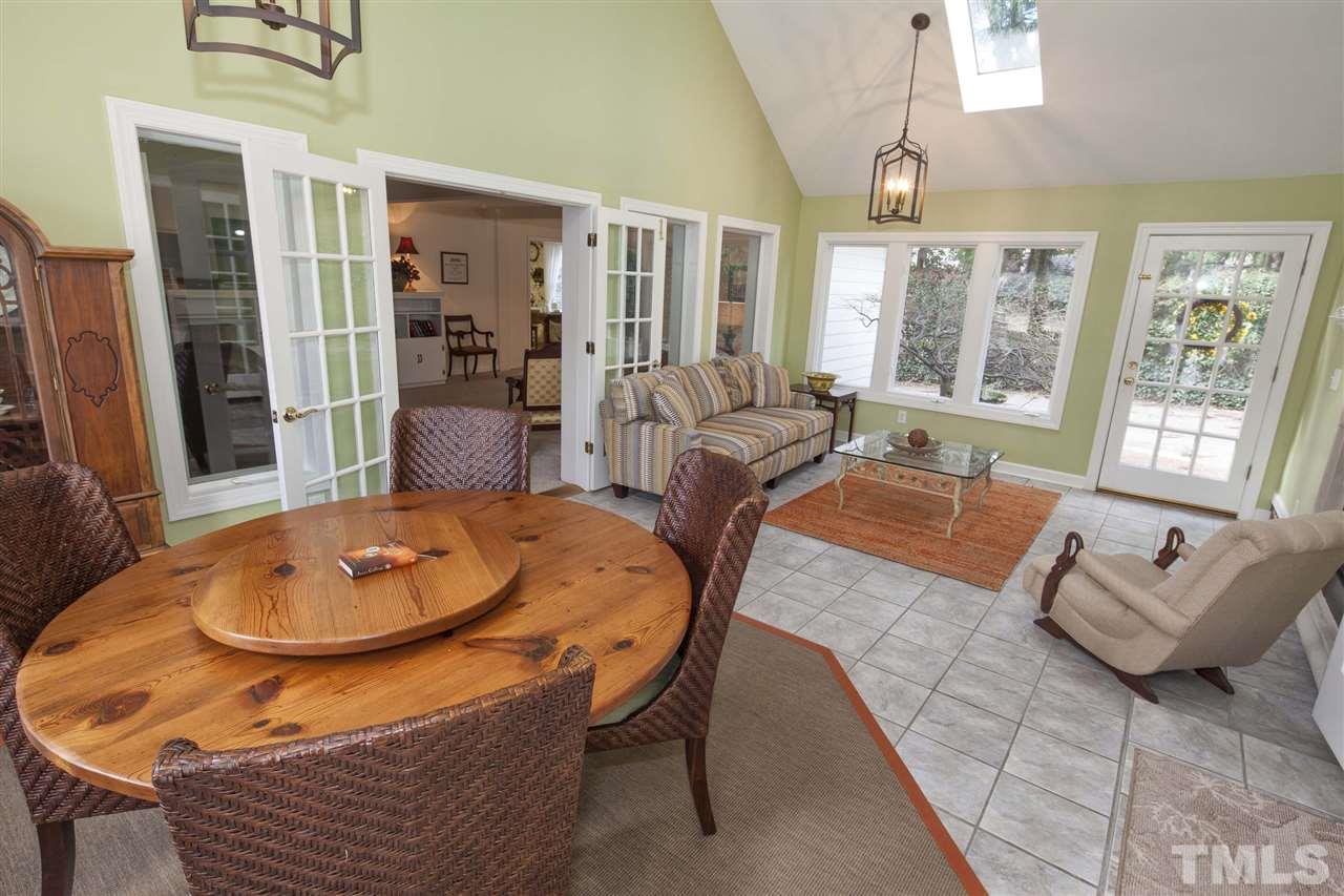 2609 Kittrell Drive Raleigh, NC 27608 - Photo 7 of 25 a living room with furniture and a table