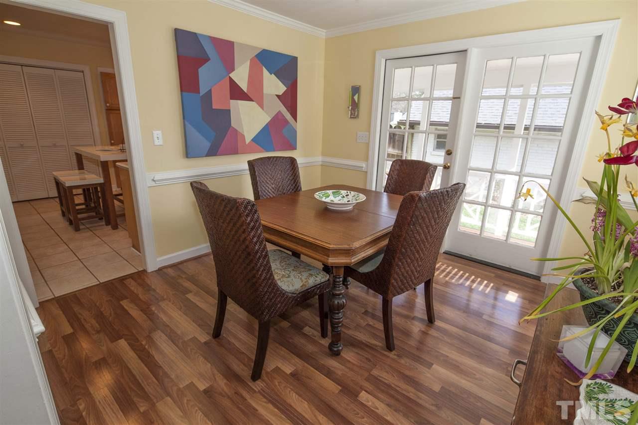 2609 Kittrell Drive Raleigh, NC 27608 - Photo 8 of 25 a view of a dining room with furniture and wooden floor