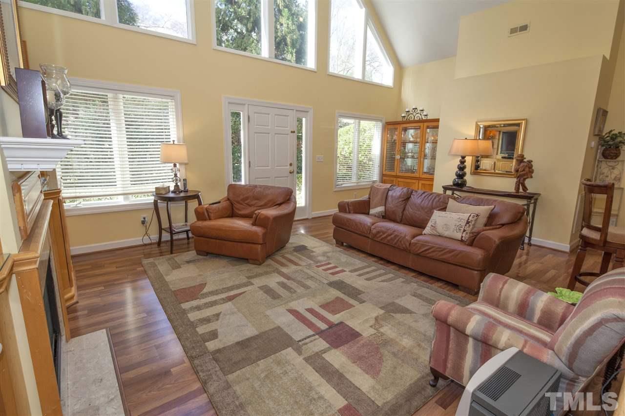 2609 Kittrell Drive Raleigh, NC 27608 - Photo 9 of 25 a living room with furniture and a fireplace