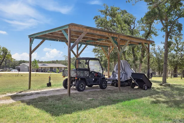 a view of a car parked in the yard