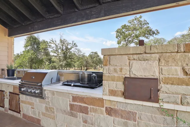 a view of balcony with furniture