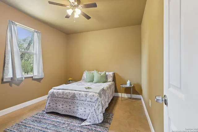 a spacious bathroom with a double vanity sink mirror and toilet