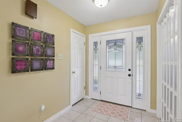 a view of an entryway with wooden floor