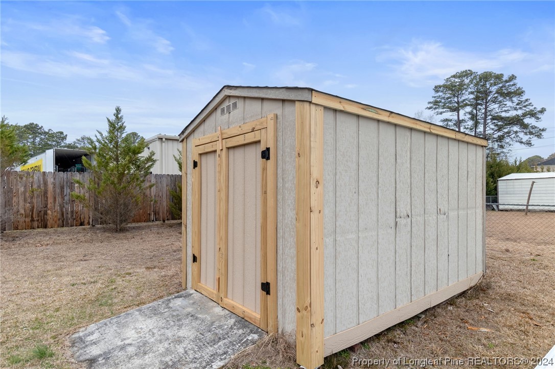 4108 Mill Bridge Road Hope Mills, NC 28348 - Photo 26 of 27 a view of a house with backyard