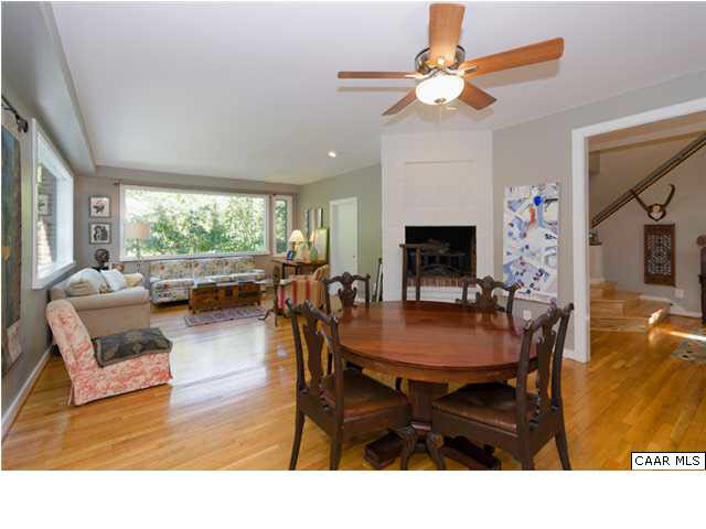 716 Wolf Trap Road Charlottesville, VA 22911 - Photo 11 of 26 a living room with furniture a fireplace and a chandelier