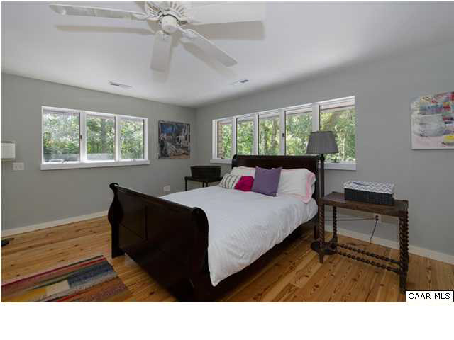 716 Wolf Trap Road Charlottesville, VA 22911 - Photo 12 of 26 a living room with furniture a window and a chandelier