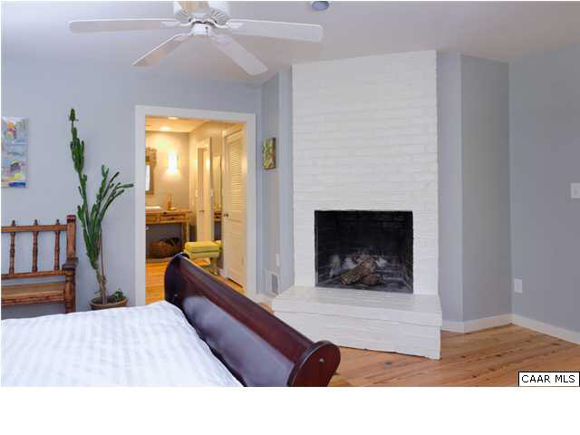 716 Wolf Trap Road Charlottesville, VA 22911 - Photo 13 of 26 a living room with furniture and a fireplace
