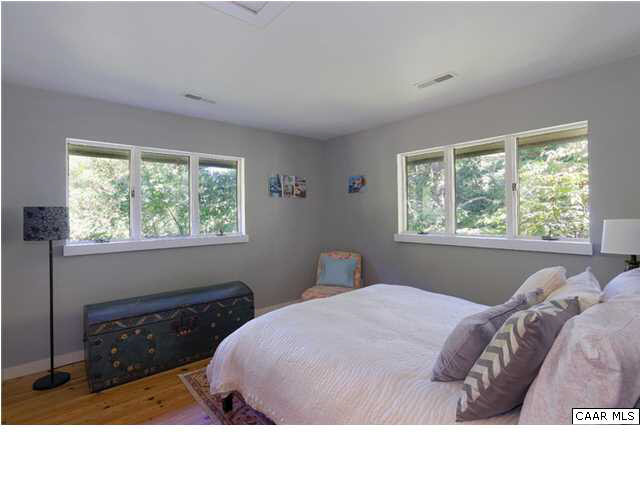 716 Wolf Trap Road Charlottesville, VA 22911 - Photo 15 of 26 a bedroom with a bed window and lamp