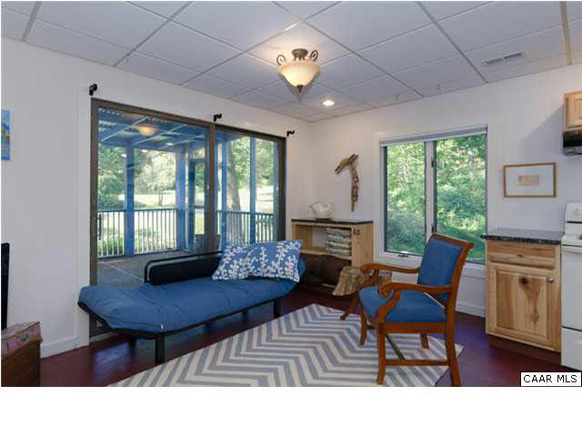 716 Wolf Trap Road Charlottesville, VA 22911 - Photo 17 of 26 a living room with furniture and a large window
