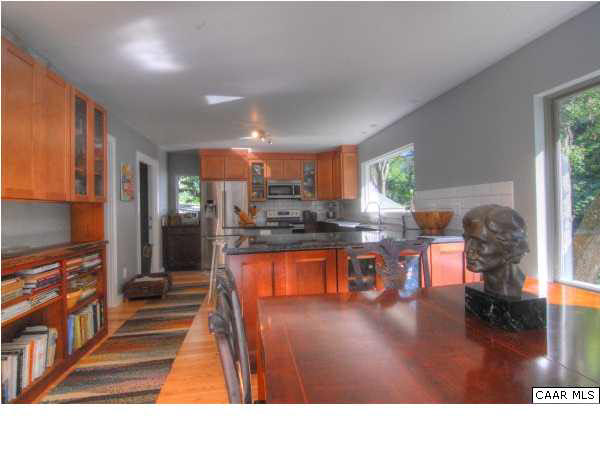 716 Wolf Trap Road Charlottesville, VA 22911 - Photo 6 of 26 a kitchen with stainless steel appliances granite countertop a stove refrigerator and cabinets