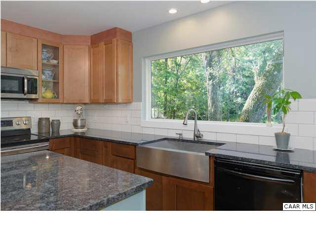 716 Wolf Trap Road Charlottesville, VA 22911 - Photo 9 of 26 a kitchen with a stove a sink a counter space and cabinets