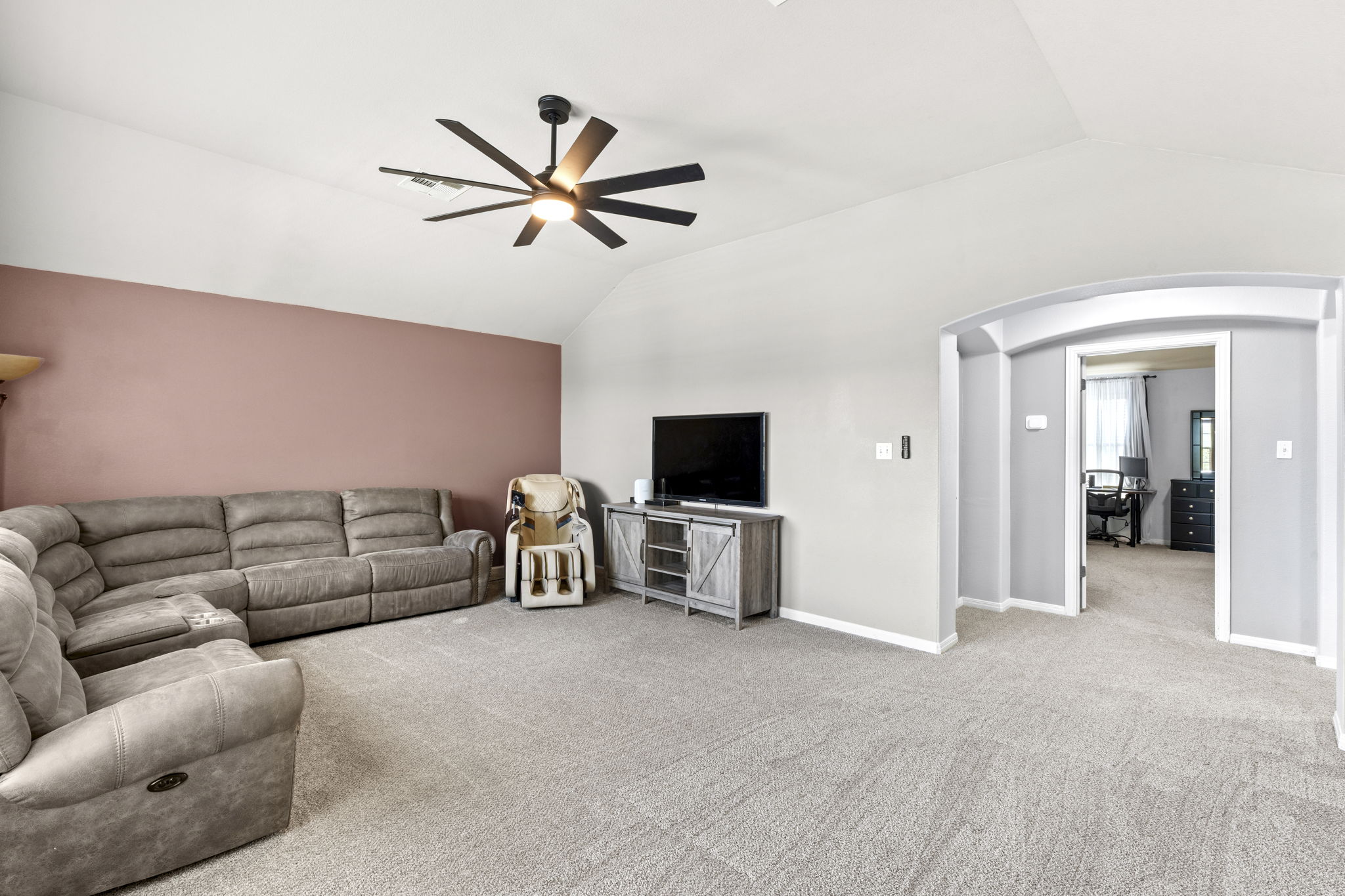 227 Sandstone Trail Buda, TX 78610 - Photo 17 of 33 Vaulted ceiling with a contemporary black ceiling fan featuring an integrated light