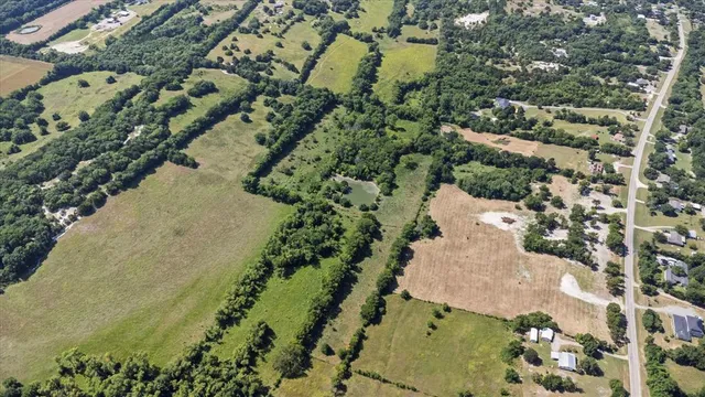 an aerial view of a houses with outdoor space