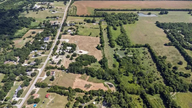 an aerial view of residential house with outdoor space