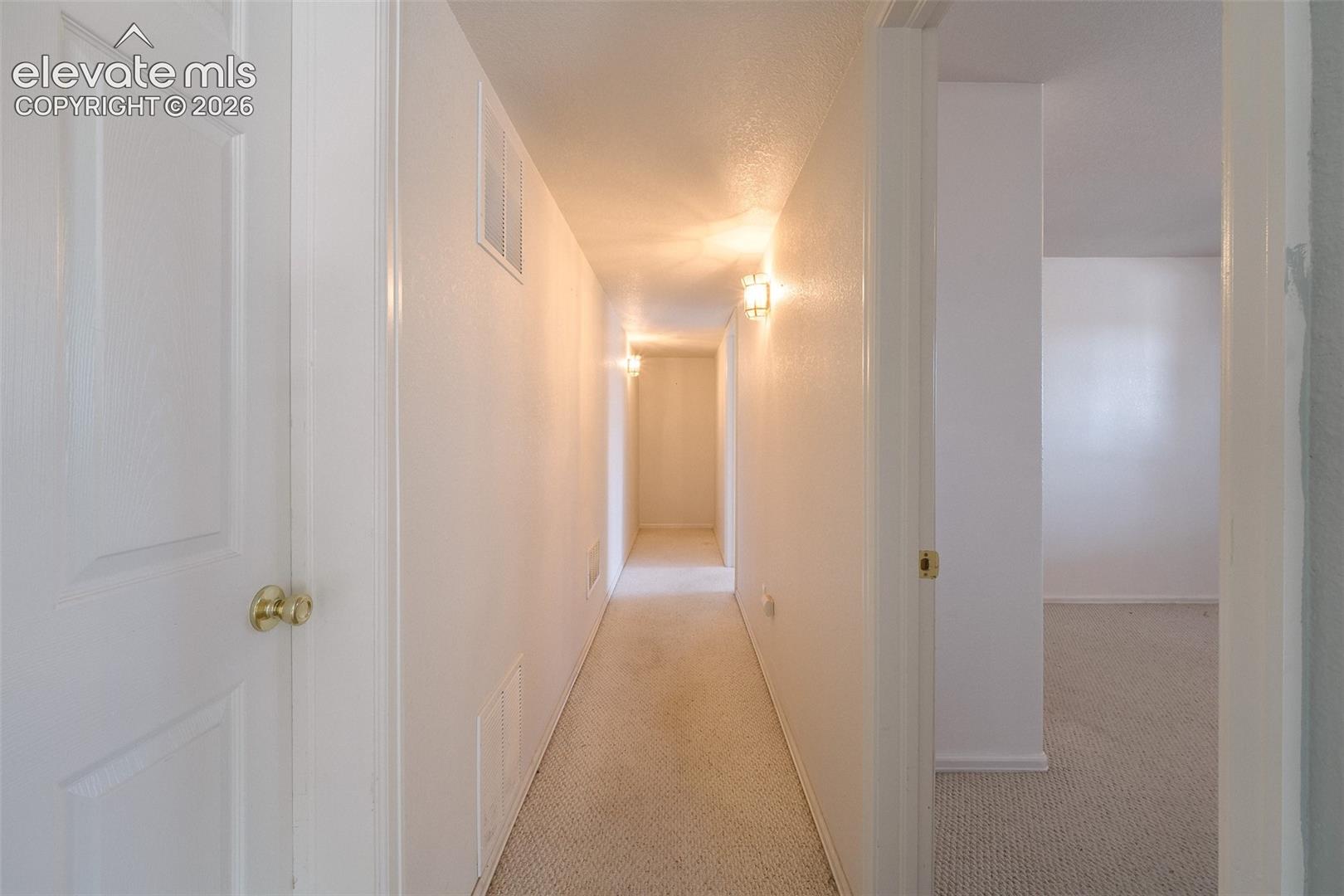7869 Fort Smith Road Peyton, CO 80831 - Photo 34 of 50 Hallway to the Basement Bedrooms.